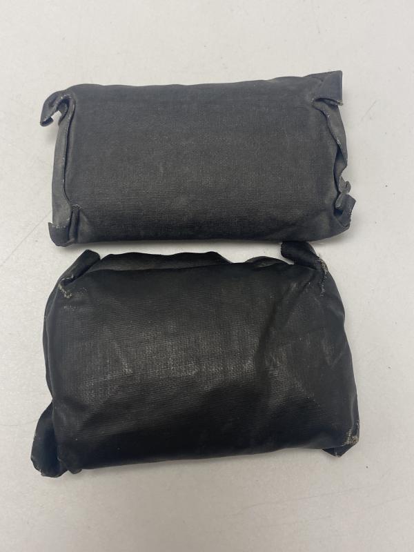 Pair of German Rubberised Covered Field Dressings